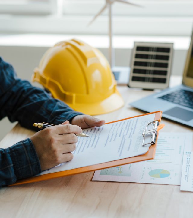 engineer,and,contractor,planning,to,install,solar,panel,on,building